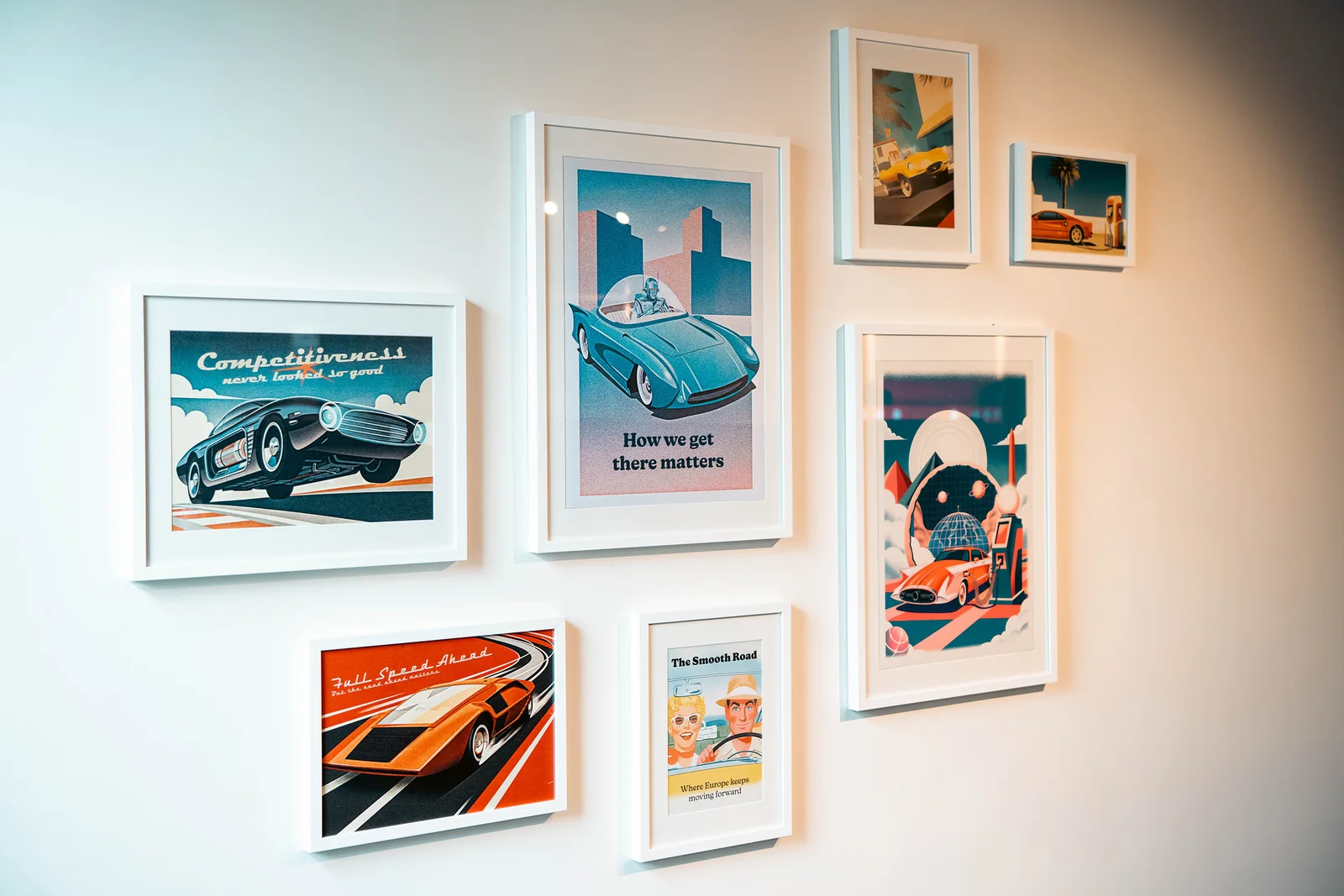 Framed automotive posters on the Roadhouse wall