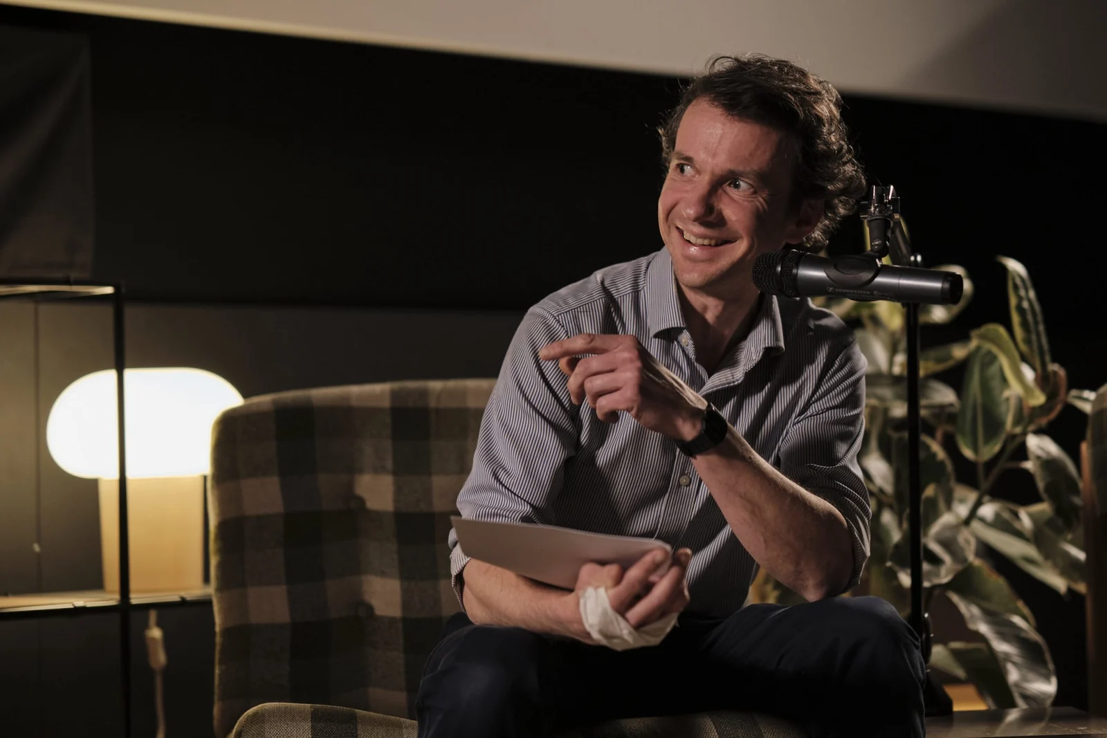 A guest speaker recording an interview on the set
