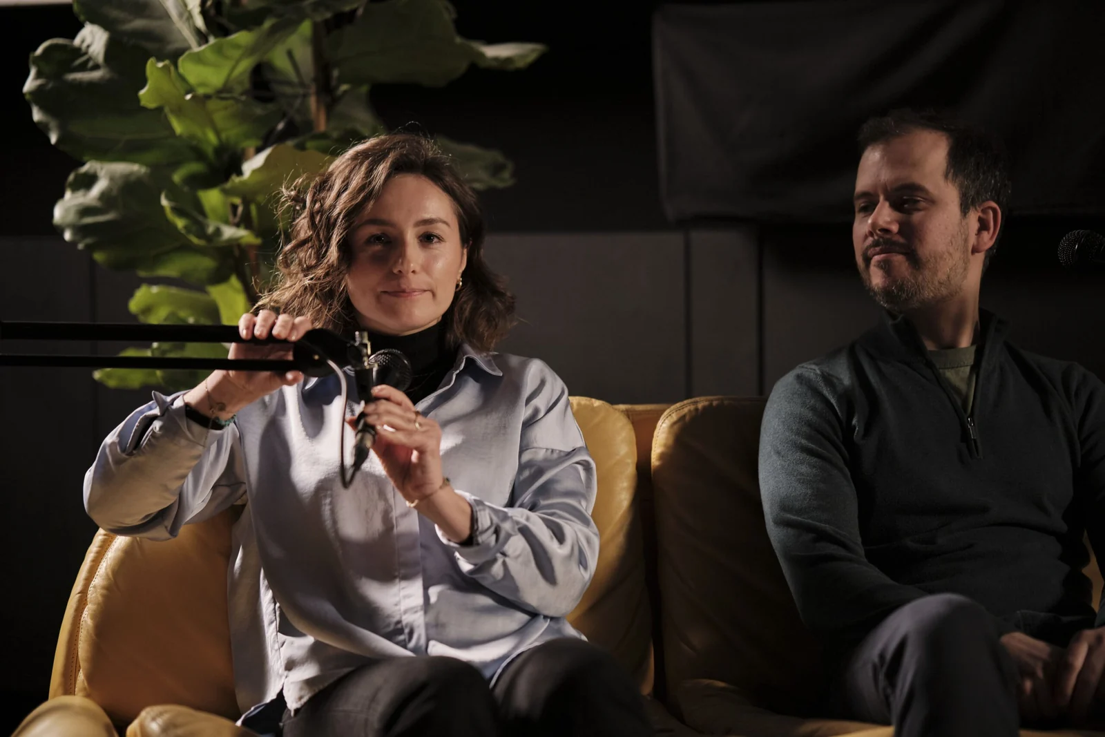 A host and guest in conversation on the set