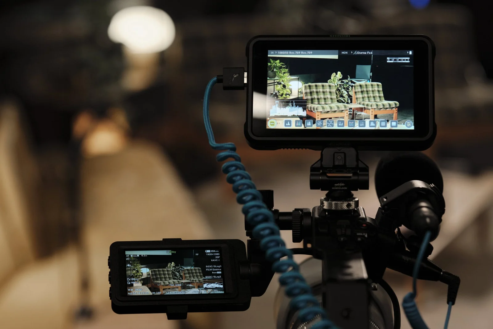 A camera monitor framing the set during a live recording