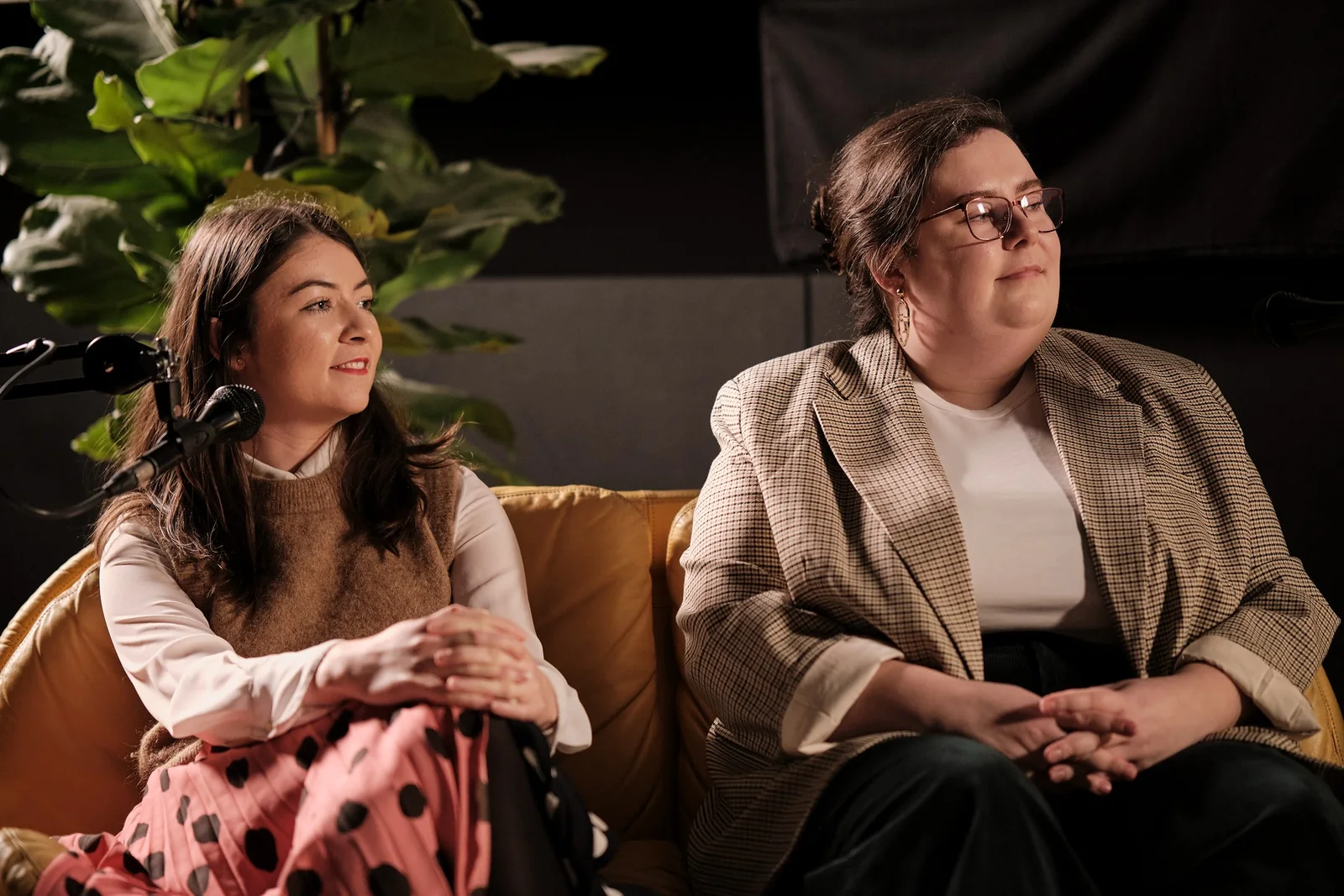 Two guests in conversation on the set