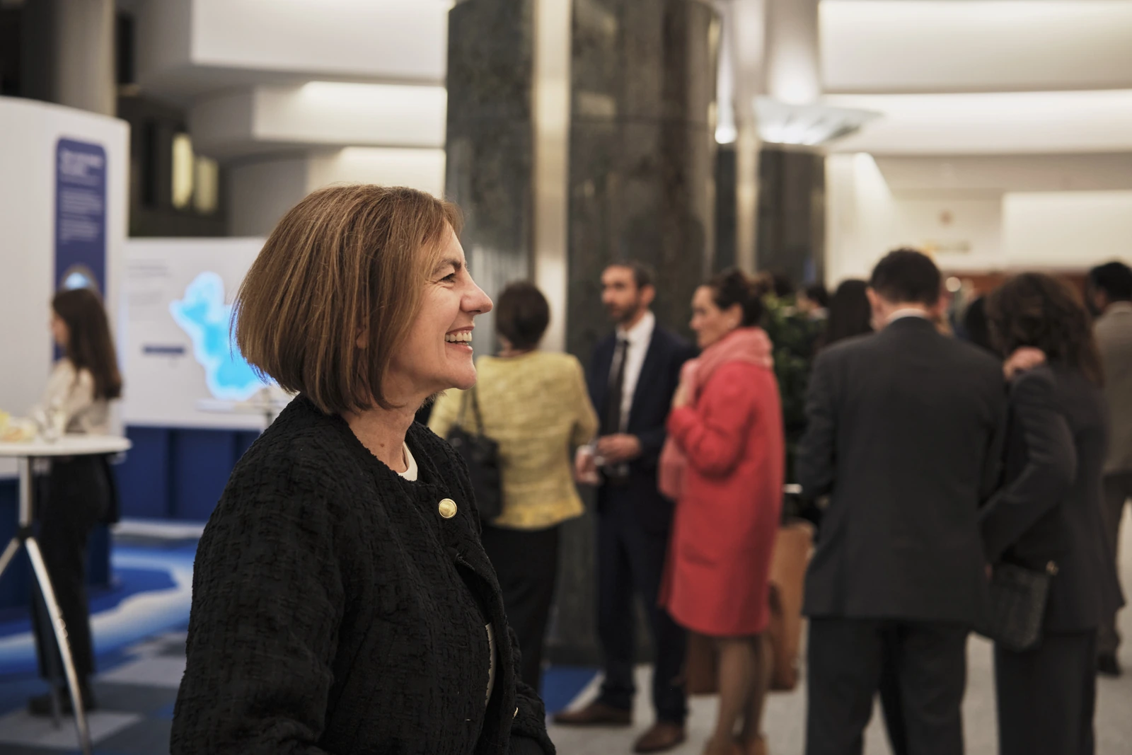Guests talking at the reception around the installation
