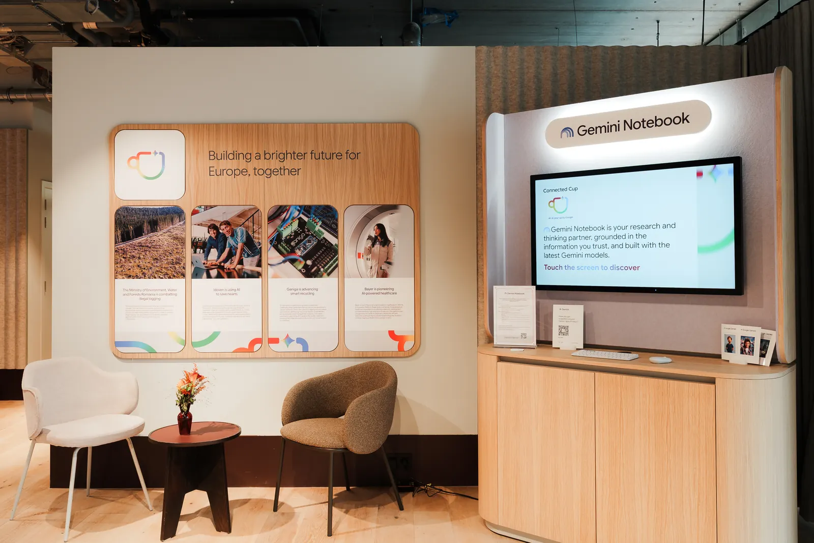 A Gemini Notebook demo station beside a panel reading &ldquo;Building a brighter future for Europe, together&rdquo;