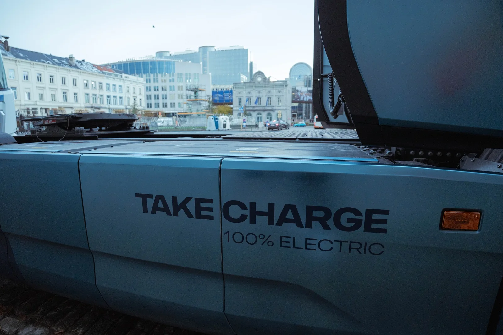 A fully electric truck marked Take Charge outside the venue