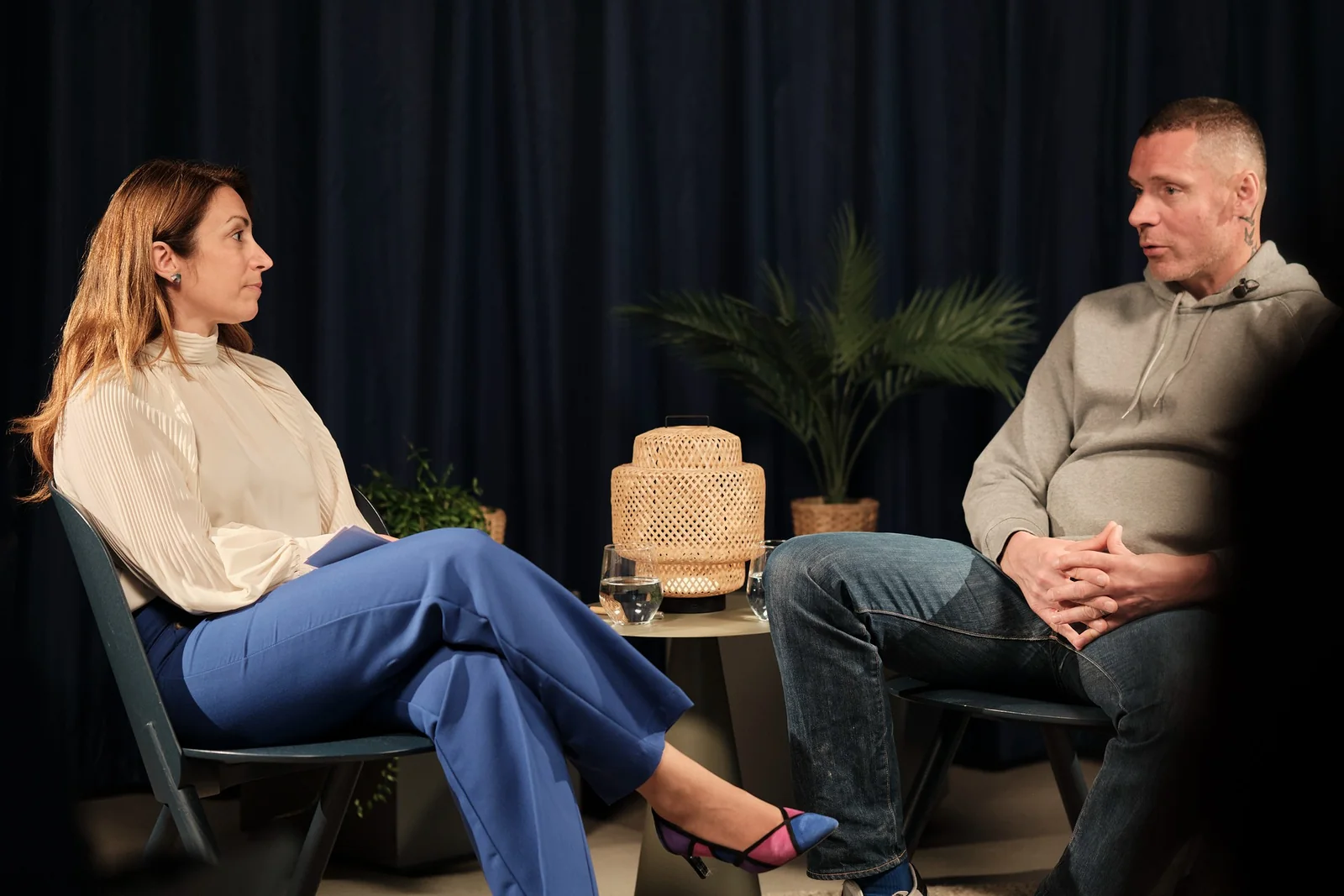 Host and guest seated on the set