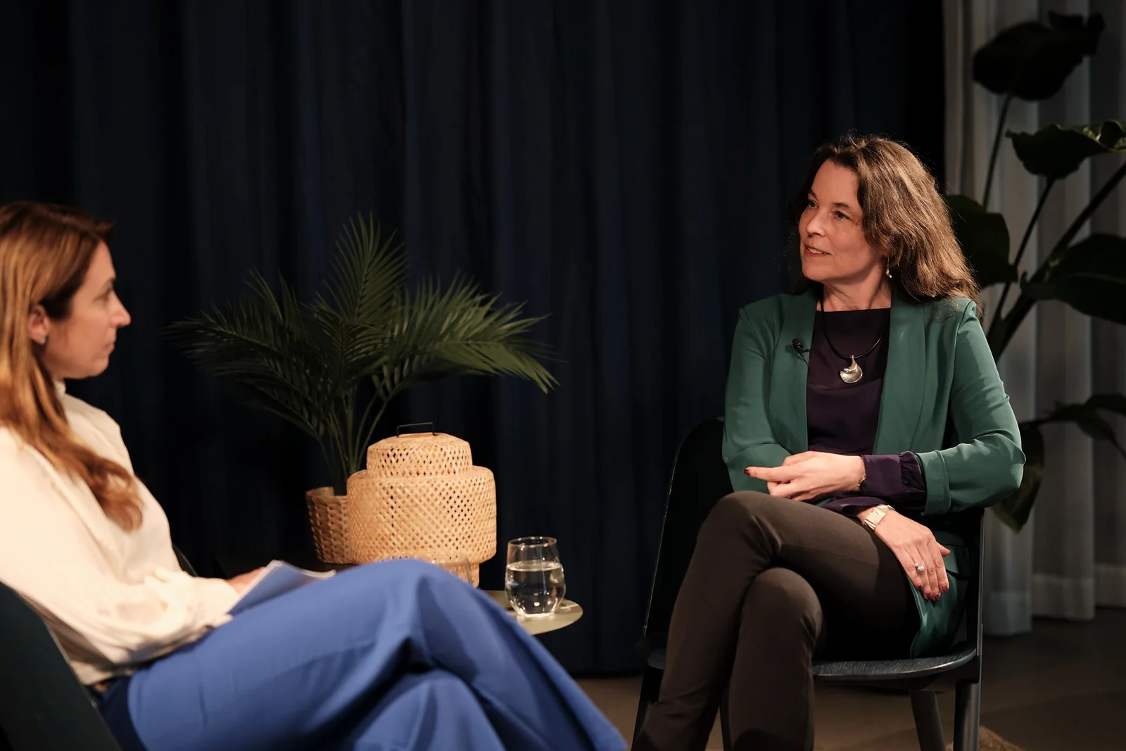 Two guests in conversation on the set