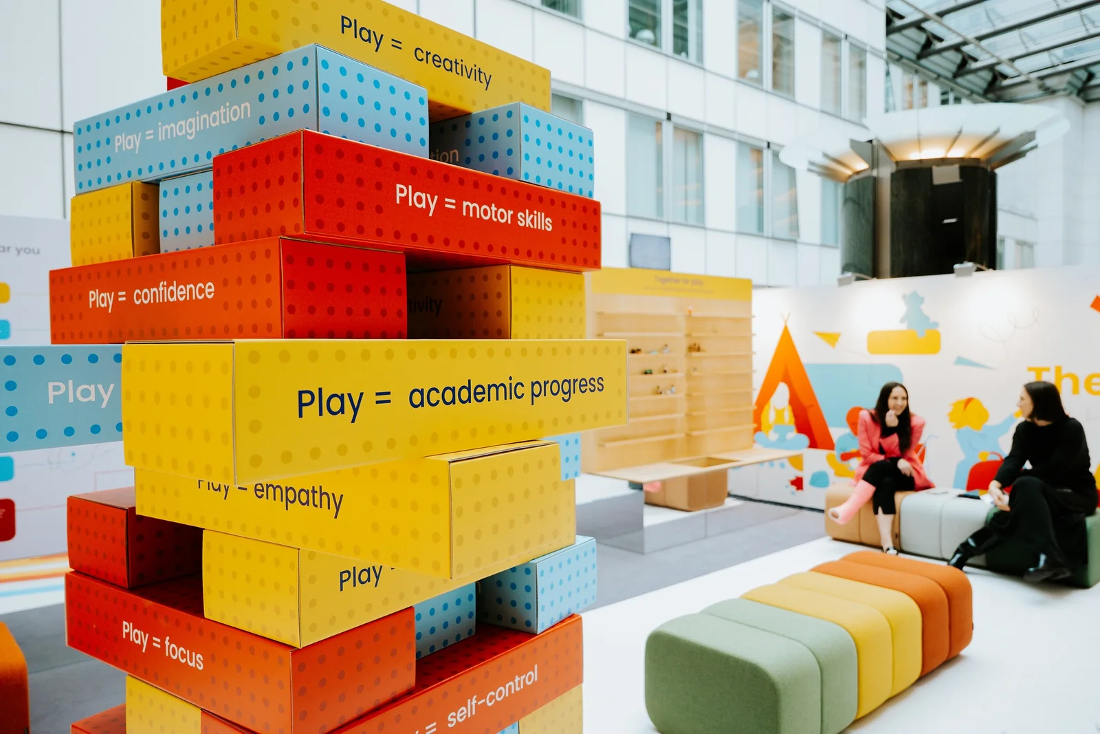 Giant blocks stacked, each printed with something play builds